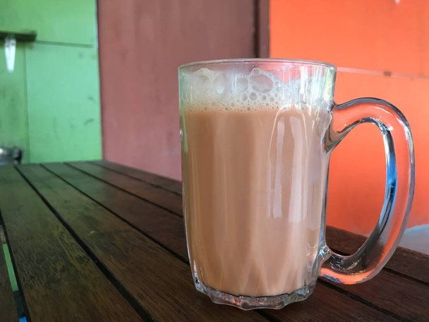 Teh with milk in a mug or popularly known as Teh Tarik. Malaysian favorite drink - Photo, Image