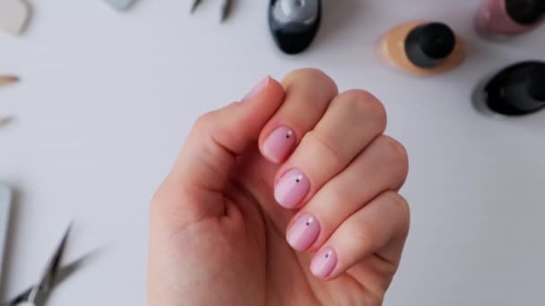 Female hands showing manicure. Advertising for nails, beauty salons, work at home with nails. Nail care, Self care. Female manicure. Do manicure by yourself - Footage, Video