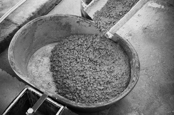 Pouring Concrete ready mix into concrete tray at construction site - Photo, Image