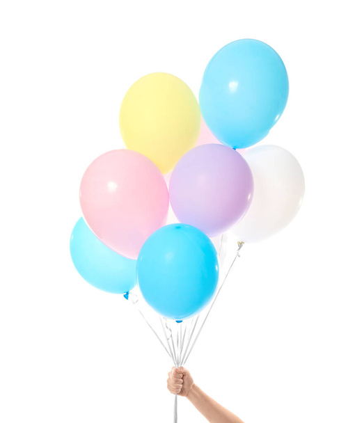Рука людини з повітряними кульками на білому тлі
 - Фото, зображення