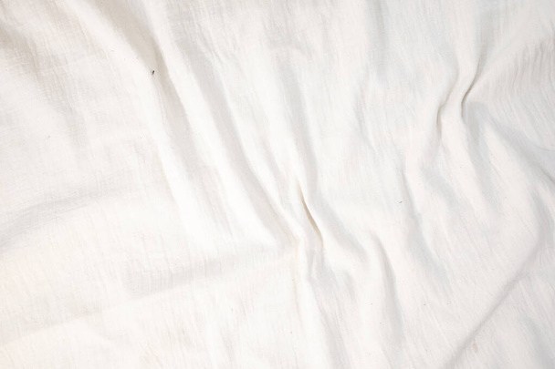 Fabric backdrop White linen canvas crumpled natural cotton fabric Natural handmade linen top view background Organic Eco textiles White Fabric linen texture  - Photo, Image