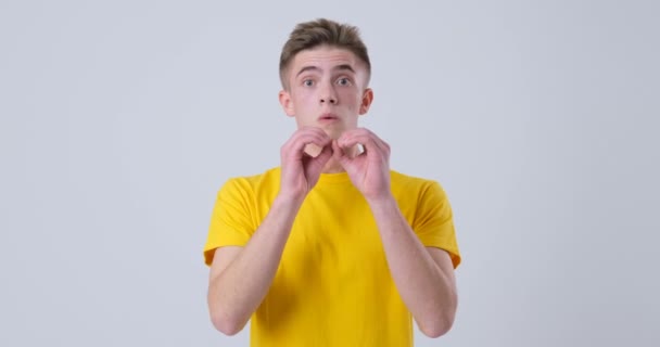 Man making funny binoculars hands gesture - Footage, Video