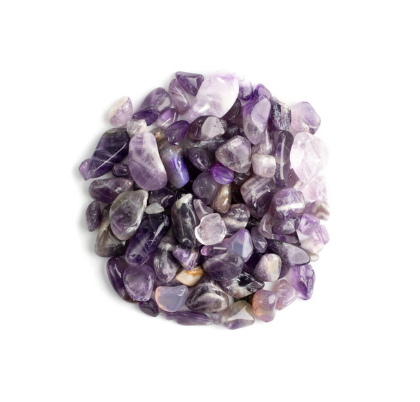 Amethyst group isolated. Purple quartz pebbles and crystal, polished violet stones, gemstones cabochons top view - Photo, Image