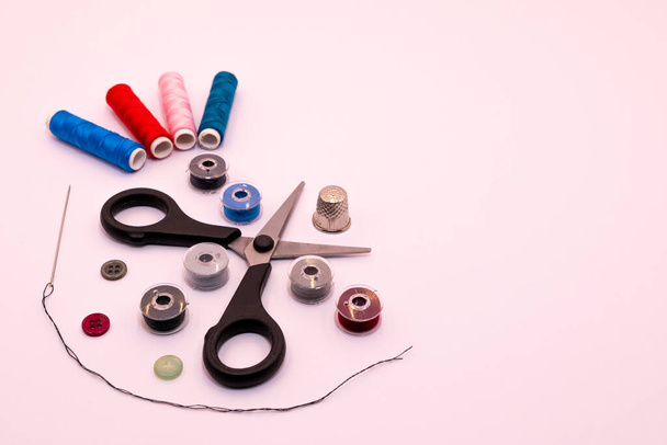 photography of sewing threads and sewing tools on white background - 写真・画像