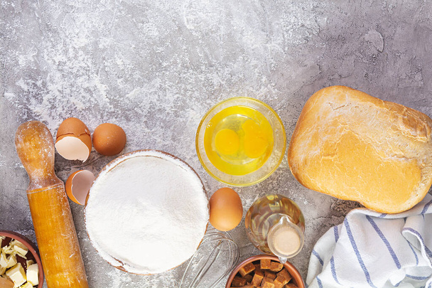 Flour and ingredients for making dough. Ingredients for baking pizza, bread, bakery - Photo, Image