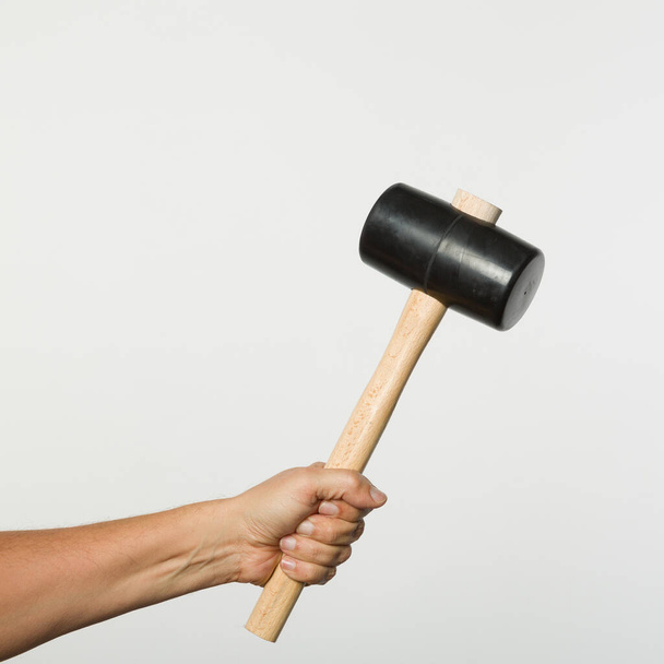 Hand with a rubber hammer  - Photo, Image