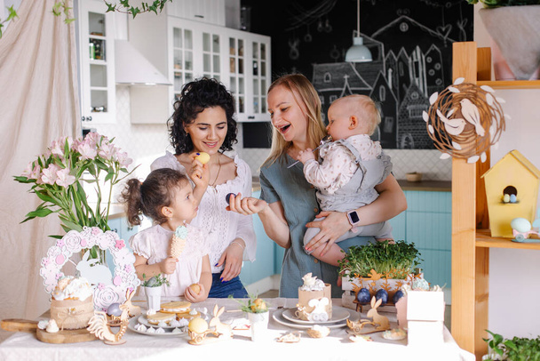happy family with kids and easter eggs in the kitchen. - Valokuva, kuva