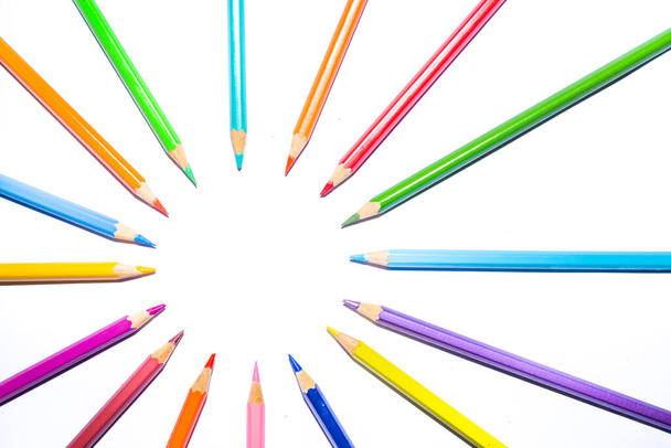 group of color pencils forming a circle on white background - Photo, Image