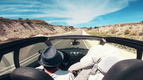 Couple on road trip driving by the coast, Santorini Island, Greece - Zdjęcie, obraz