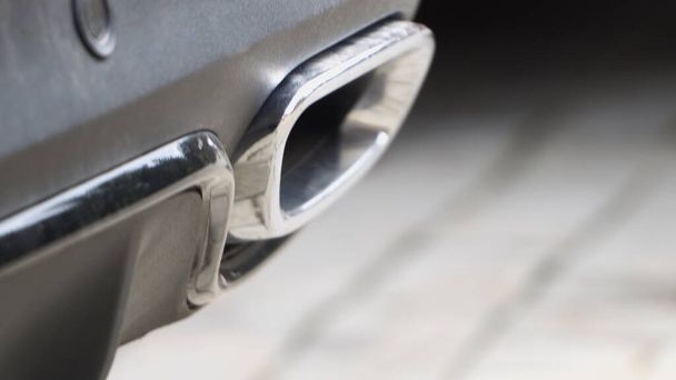 Close up of a modern car dual exhaust pipe - Foto, afbeelding