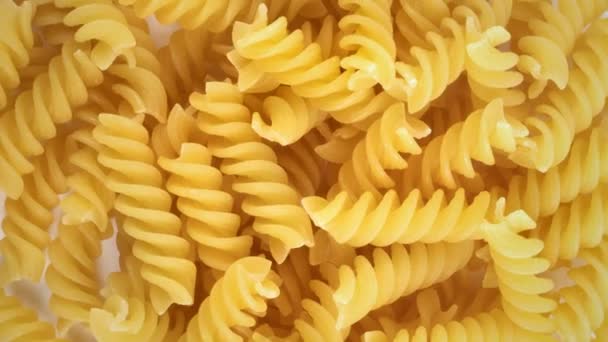 Slowly rotating pile of fusilli pasta - Footage, Video