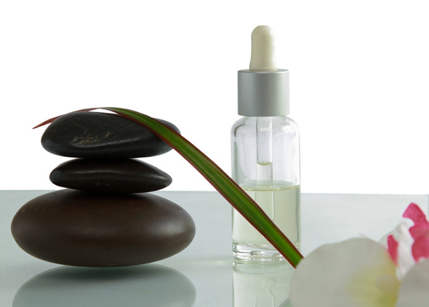 Bottles of essential oil and set of stones - Photo, Image