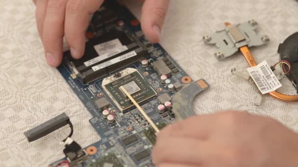 Closeup of technician hands repairing laptop computer cooling system. - Footage, Video