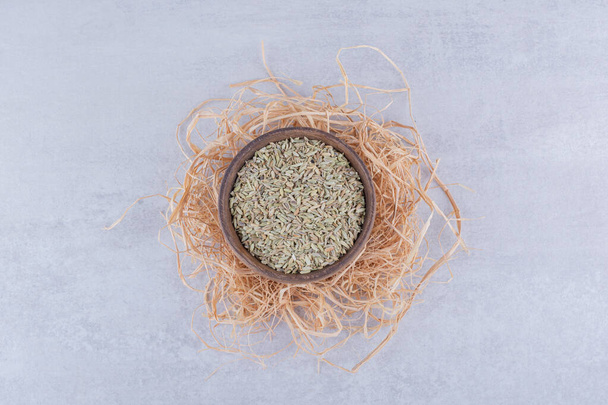 Green dry anise seeds in a plate on concrete background. High quality photo - Photo, Image