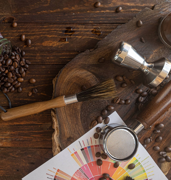 Barista coffee tools and roasted coffee beans on wooden board - Photo, Image