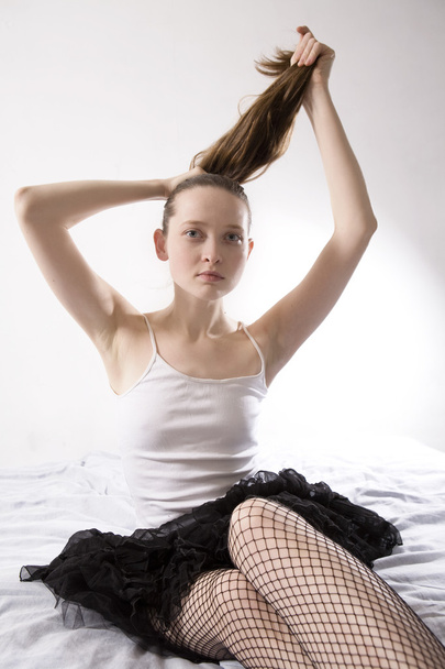 ttractive serious girl doing hair up - Valokuva, kuva