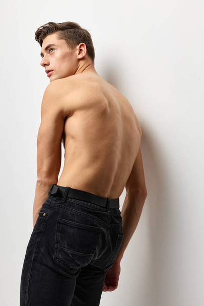 male topless standing back black pants posing fashion luxury - Фото, изображение