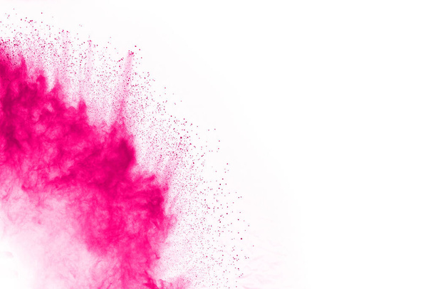 Abstract pink powder splatted background,Freeze motion of color powder exploding/throwing color powder,color glitter texture on white background. - Photo, Image