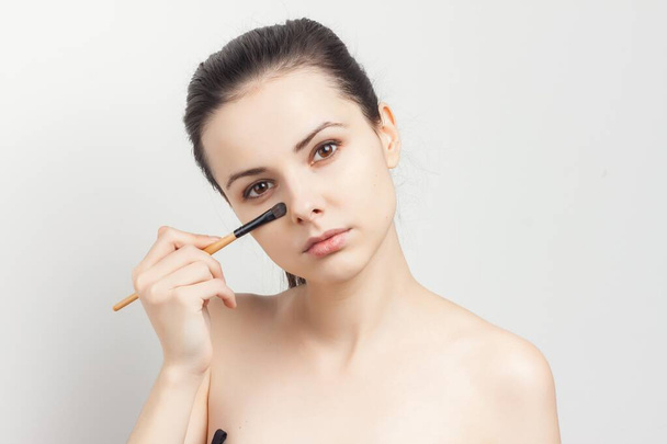 attractive brunette naked shoulders cosmetics skin care makeup - Photo, Image
