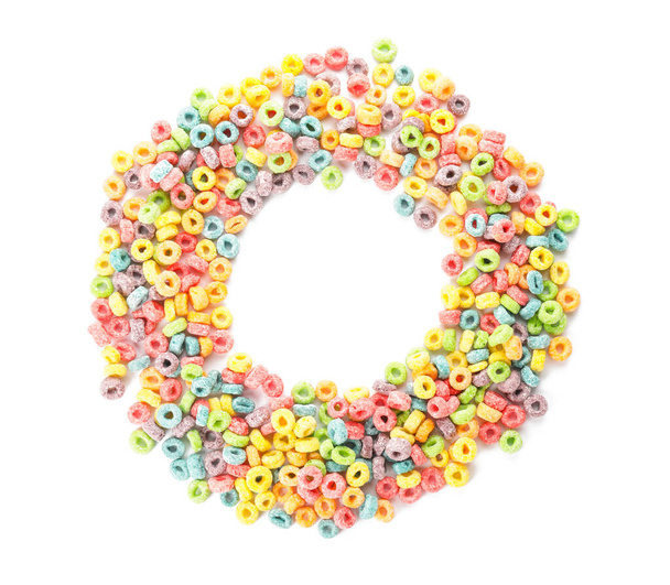 Frame made of tasty cereal rings on white background - Photo, Image