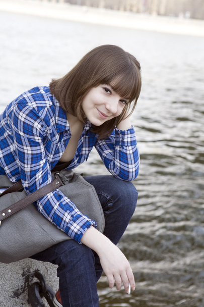 Teenage girl on river - 写真・画像