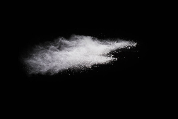 White powder explosion on black background. Colored cloud. Colorful dust explode. Paint Holi. - Photo, Image