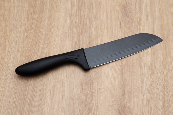 set of black luxury kitchen knife on wooden table  - Photo, Image