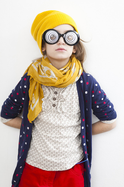 Silly little girl ten years old in yellow knitting  hat - Foto, Bild