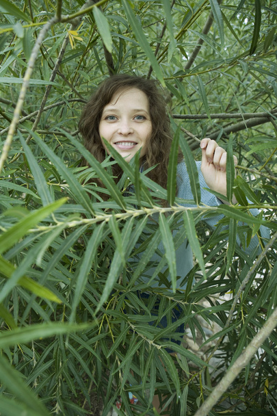 Young woman in forest. - Zdjęcie, obraz