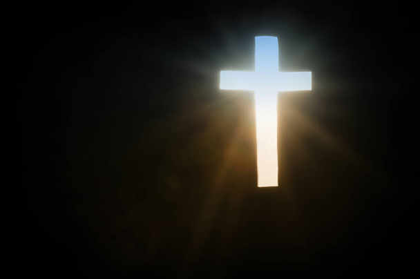 Rays of Sun through the cross bringing hope - Photo, Image