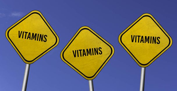 Vitaminas - tres signos amarillos con fondo de cielo azul - Foto, imagen