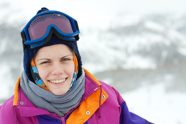 Portrait of a young, smiling female skier - Fotografie, Obrázek