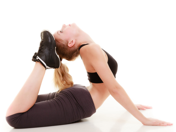 young sporty girl doing stretching exercise isolated. Healthy lifestyle - Foto, Imagen