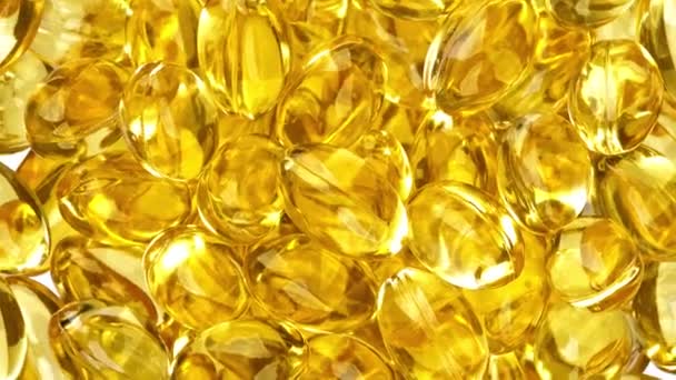 Slowly rotating fish oil nutritional supplement capsules - Footage, Video