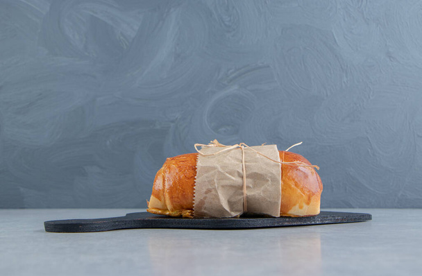 Sweet tasty pastry on black board. High quality photo - Photo, Image