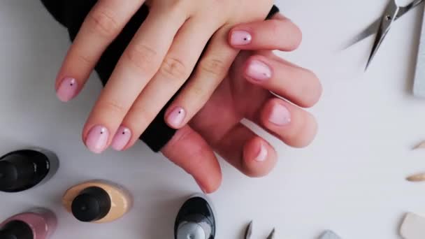 Female hands showing manicure. Advertising for nails, beauty salons, work at home with nails. Nail care, Self care. Female manicure. Do manicure by yourself - Footage, Video