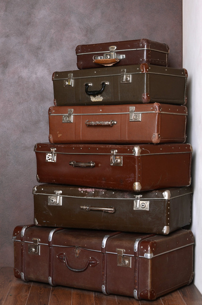 Old retro suitcases at a wall - Fotó, kép
