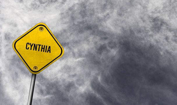 Синтія - жовтий знак з хмарним тлом - Фото, зображення