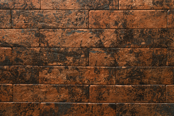 background of wall from bricks in brown and black gradient, top view - Photo, Image