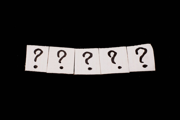 a question mark on a white sheet . FAQ frequency asked questions, Answer, Information and Brainstorming Concepts - Photo, Image