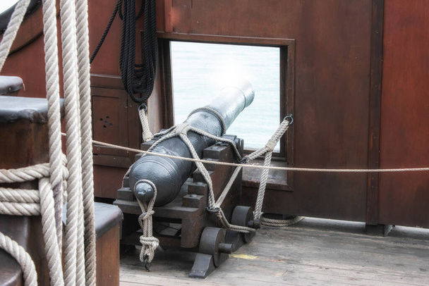 a rear view of cannon in its porthole Spanish galleon - Photo, Image