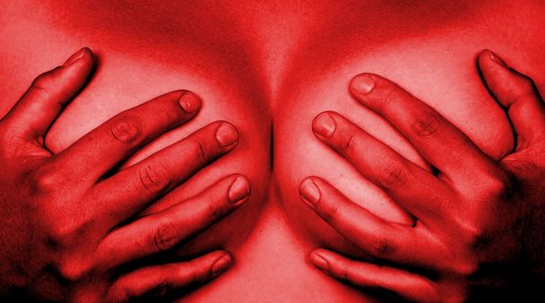 Hands covering breasts - 写真・画像