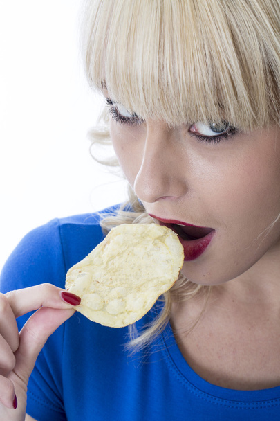 Young Woman Eating Potato Crisps - Foto, Imagen