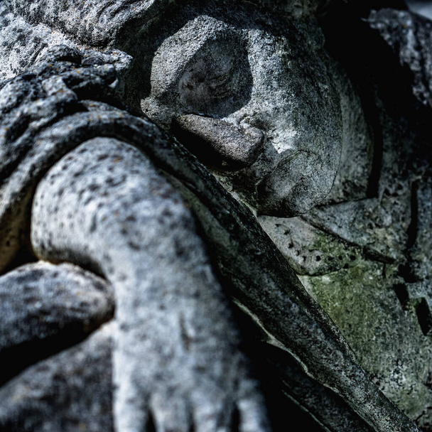 Death. Close up an ancient stone statue of woman on the tomb. Pain, fear and end of human life concept. - Photo, Image