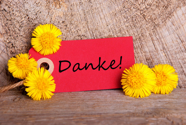 Etiqueta roja con Danke
 - Foto, Imagen