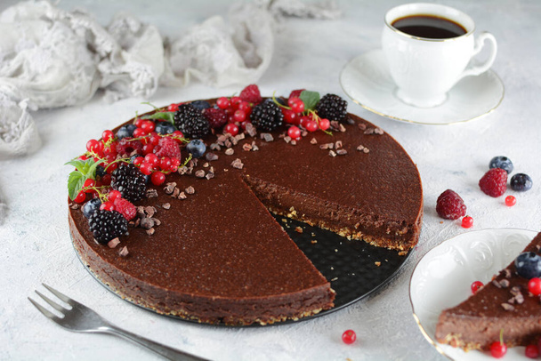 Raw, Sugar-Free Vegan Cheesecake with Walnut and Date Crust and Raw Cocoa and Cashew Filling - Photo, Image
