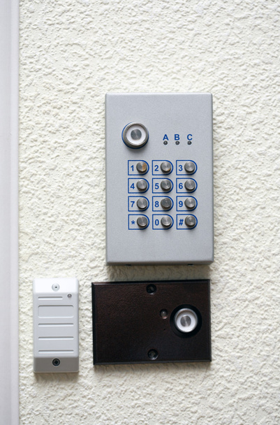 A security pad and voice intercom system on the wall - Photo, Image