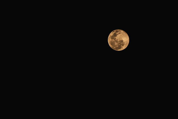 The full moon isolated on black space background. - 写真・画像