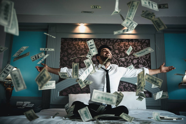 Handsome young bearded businessman with cash  - Foto, Imagen
