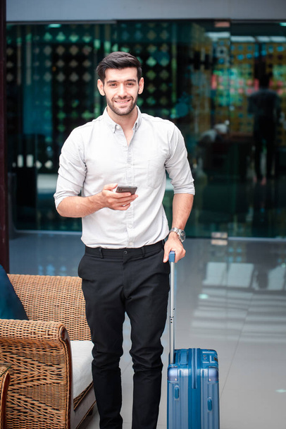 Handsome young bearded businessman with mobile phone - Zdjęcie, obraz